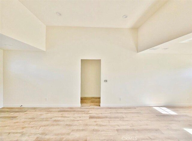 spare room featuring light hardwood / wood-style floors