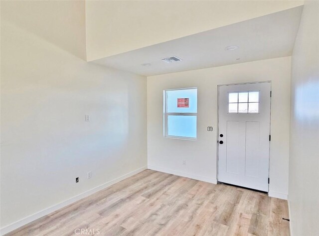 foyer entrance with light hardwood / wood-style flooring