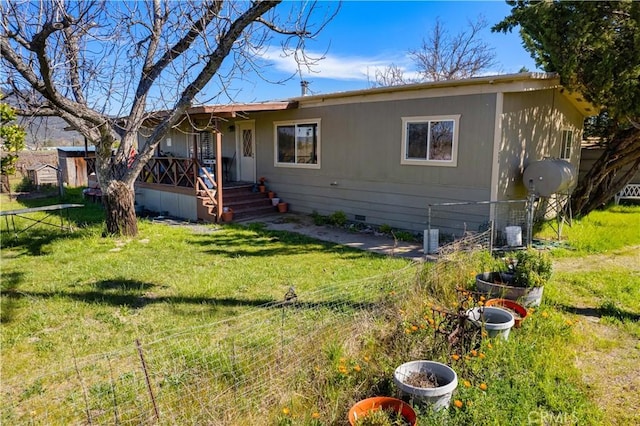 view of front of house featuring crawl space, a front yard, and fence