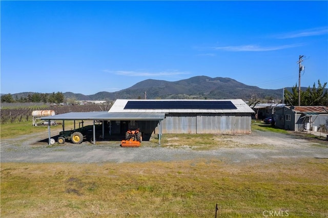 view of outbuilding with a mountain view