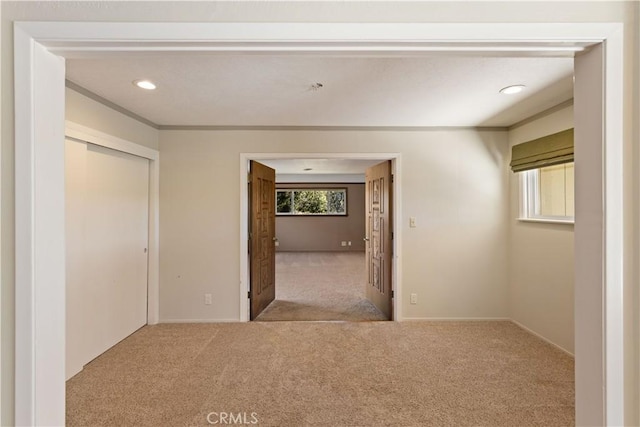 carpeted spare room with recessed lighting and ornamental molding