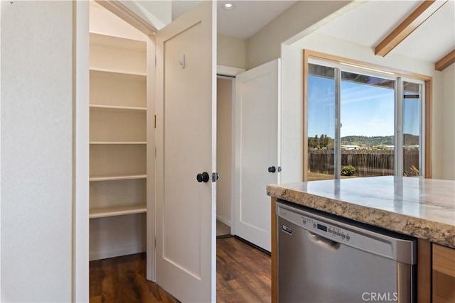 interior space with beam ceiling, light stone countertops, dishwasher, and dark wood finished floors