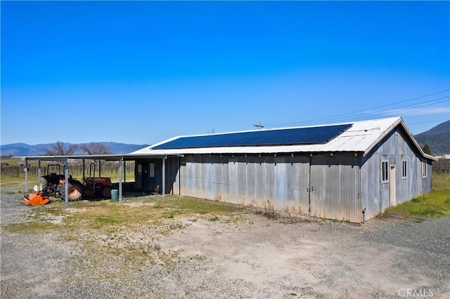 exterior space featuring a mountain view