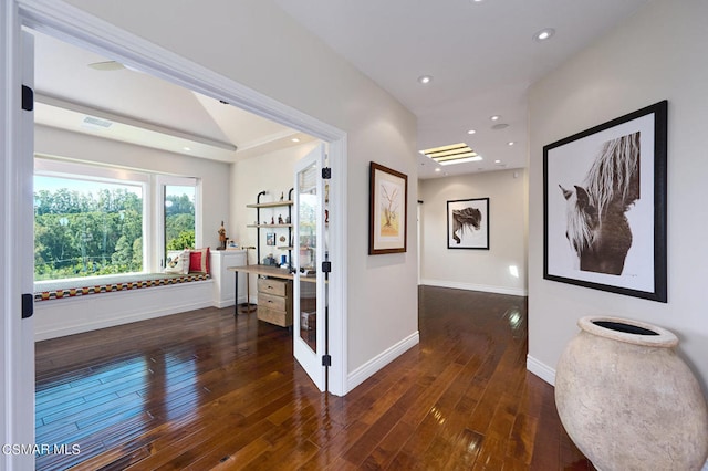 hallway with dark wood-type flooring