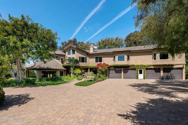 view of front of property with a garage