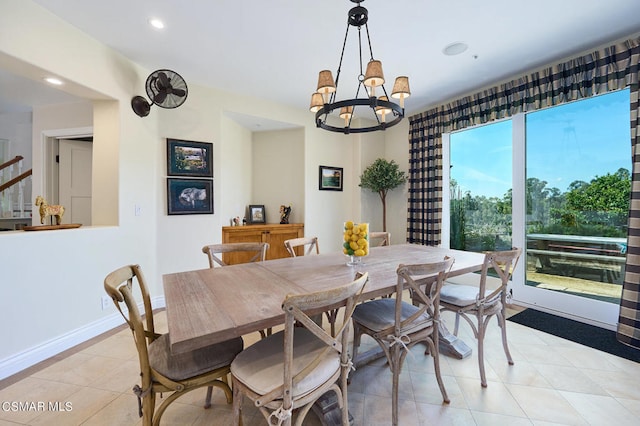 dining room featuring light tile patterned floors and an inviting chandelier