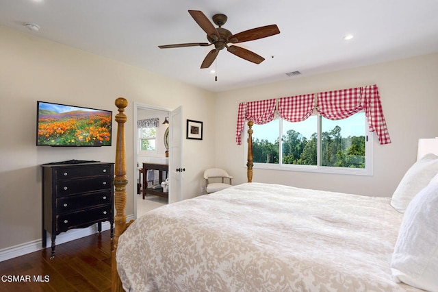 bedroom with ceiling fan, dark hardwood / wood-style floors, and multiple windows