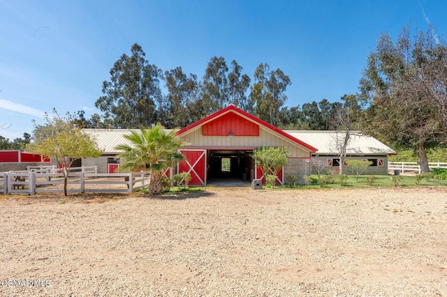 view of front of house with an outbuilding