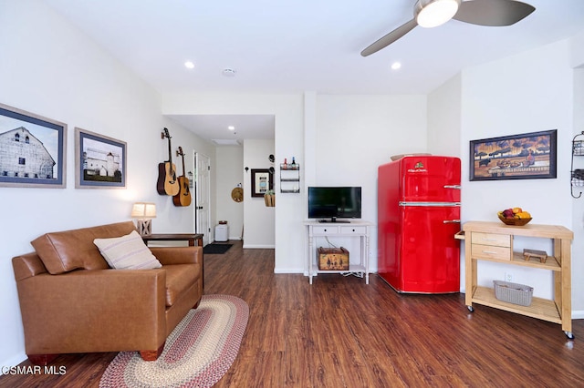 living room with dark hardwood / wood-style floors and ceiling fan