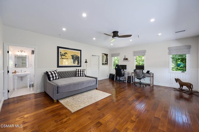 living room with ceiling fan, sink, and dark hardwood / wood-style floors