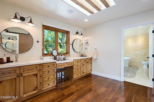 bathroom with vanity and wood-type flooring