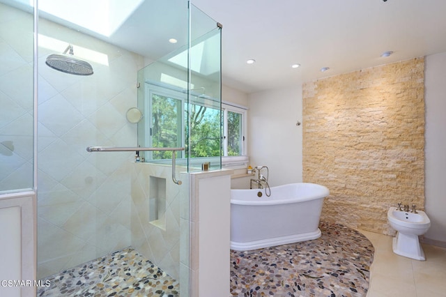 bathroom featuring tile patterned floors, a bidet, and independent shower and bath