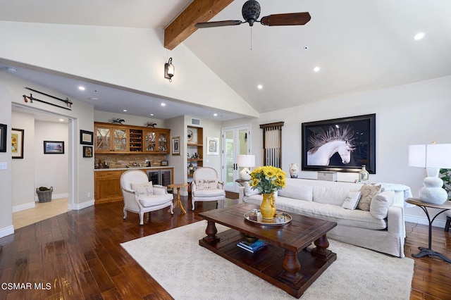 living room featuring ceiling fan, beam ceiling, dark hardwood / wood-style flooring, and high vaulted ceiling