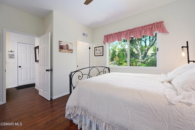 bedroom featuring ceiling fan and dark wood-type flooring