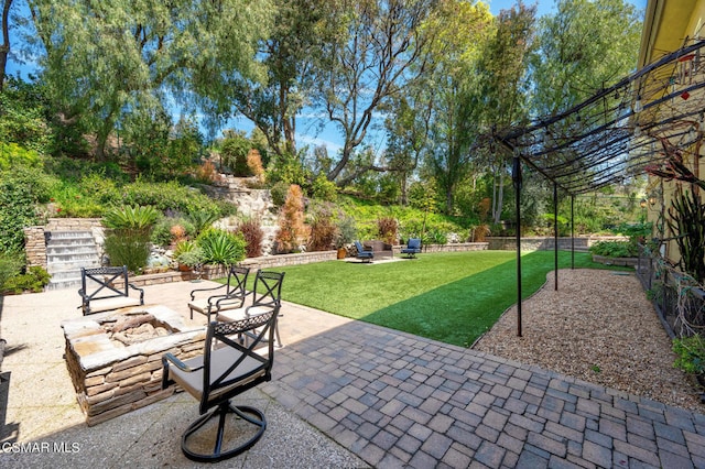 view of patio with an outdoor fire pit