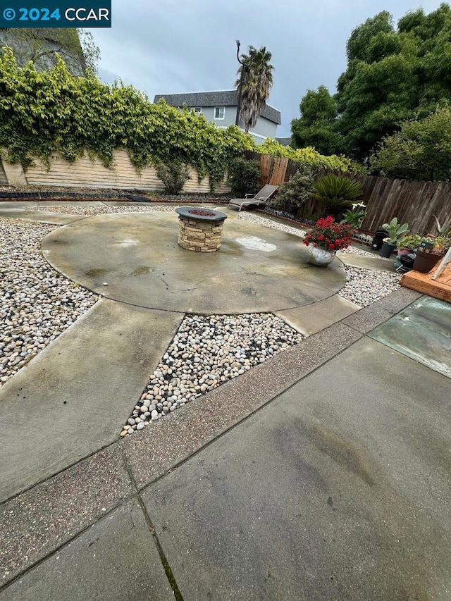 view of patio / terrace featuring a fire pit