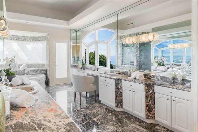 702 Via La Cuesta, Palos Verdes Estates, CA 90274 - kitchen featuring light marble finish floors, white cabinets, plenty of natural light, and a sink