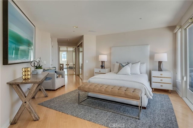 bedroom with light hardwood / wood-style floors