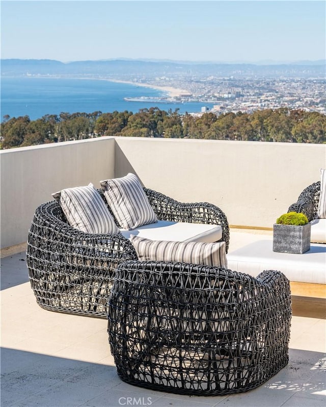 view of patio featuring a water view