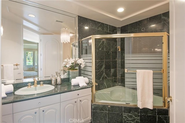 bathroom featuring vanity and shower / bath combination with glass door