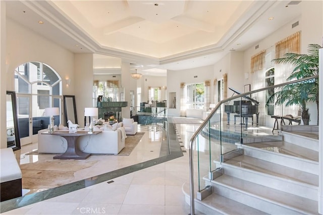 interior space featuring a high ceiling, coffered ceiling, and tile patterned flooring