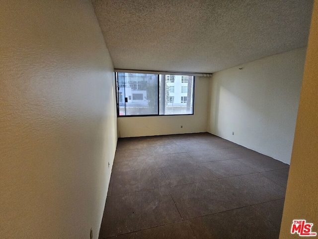 empty room with a textured ceiling