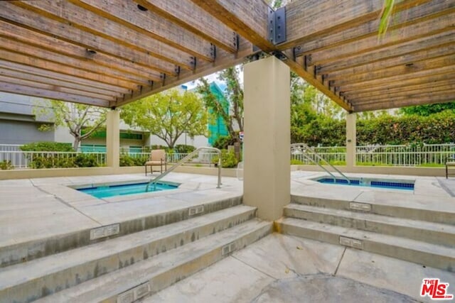 view of swimming pool with a pergola, a community hot tub, and a patio