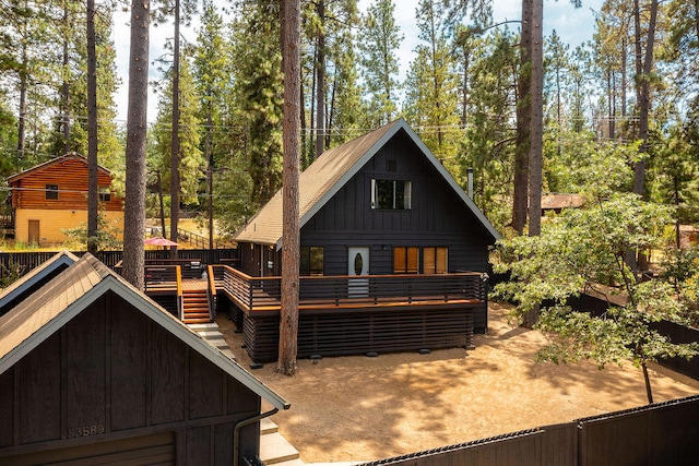 view of front facade with a wooden deck