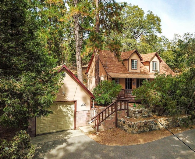 view of front of home with covered porch and a garage