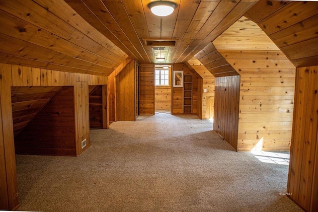 bonus room featuring carpet flooring, wooden walls, wooden ceiling, and lofted ceiling