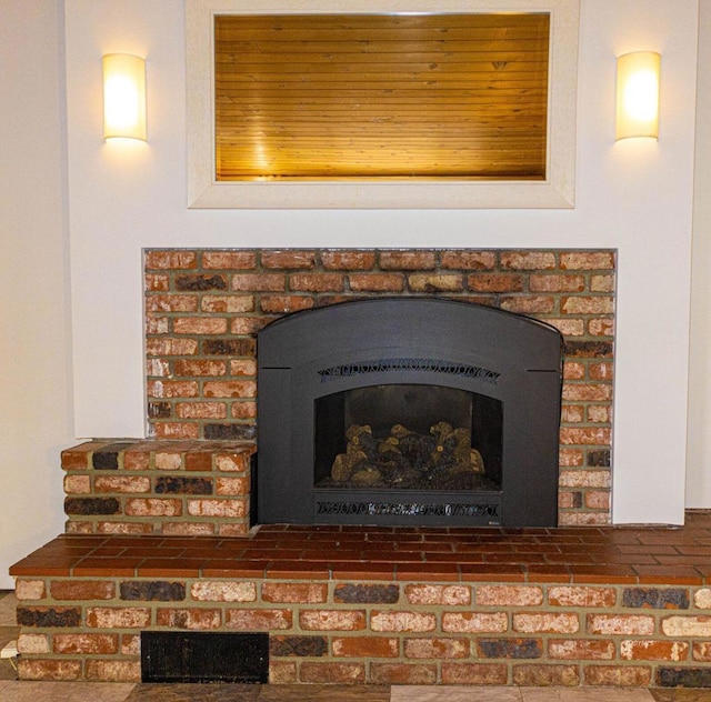 details featuring a brick fireplace