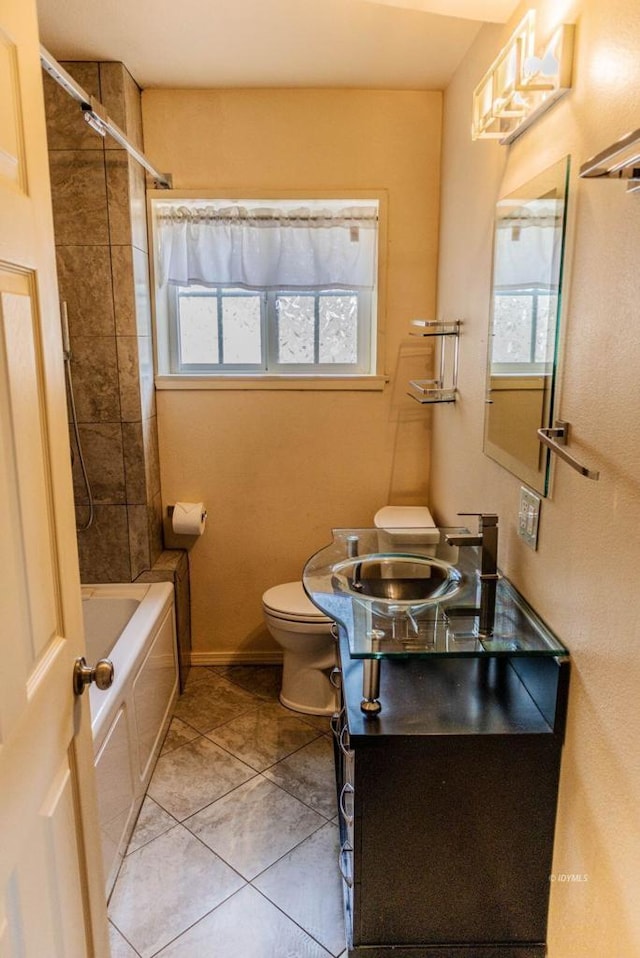 full bathroom with plenty of natural light, tile patterned flooring, tiled shower / bath combo, and toilet