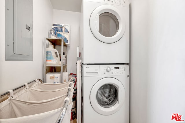 laundry area featuring stacked washer / dryer