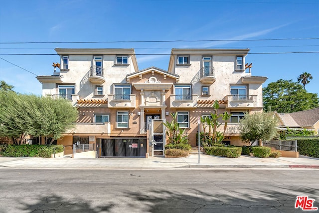 view of front of home featuring a balcony