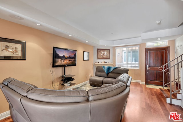 living room with light hardwood / wood-style flooring