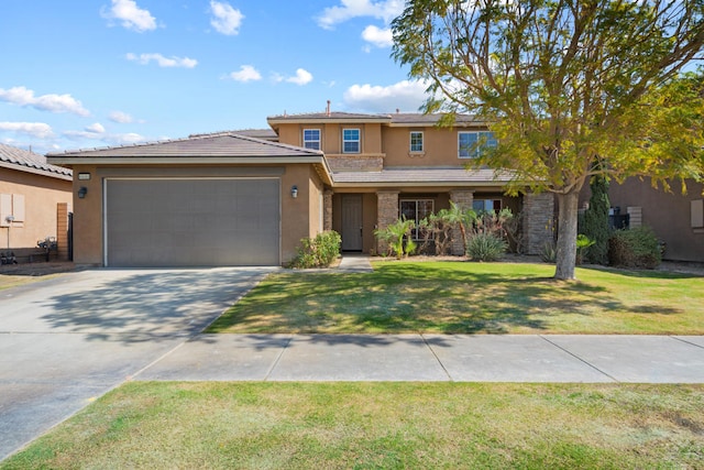 view of front of property featuring a front lawn and a garage