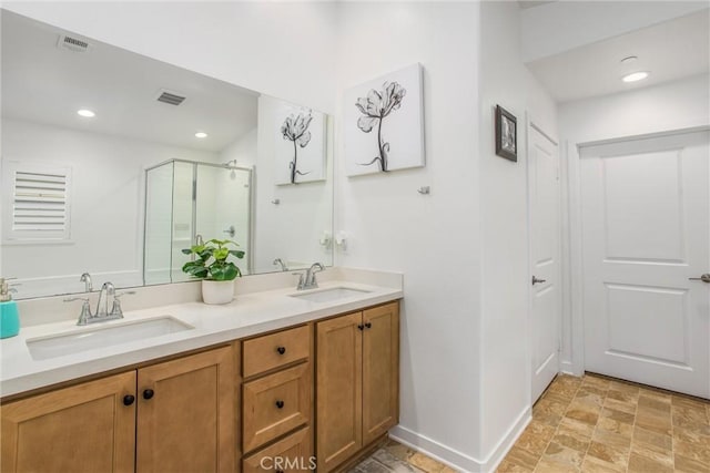 bathroom with vanity and an enclosed shower