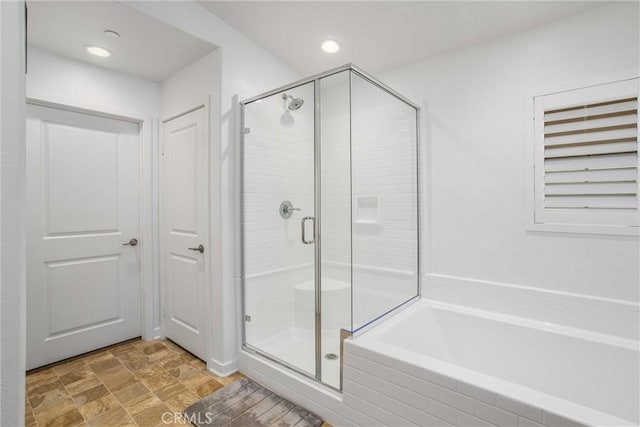 bathroom with separate shower and tub