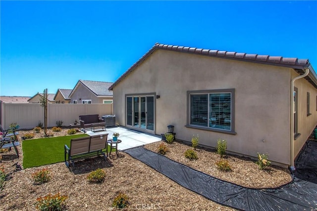 rear view of house featuring a patio