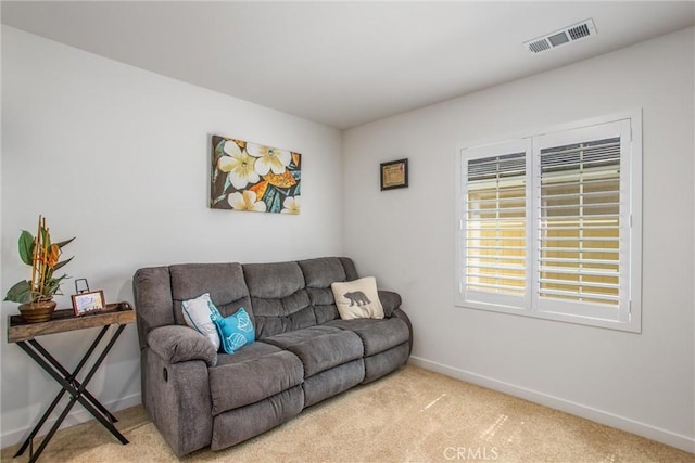 living room featuring light carpet