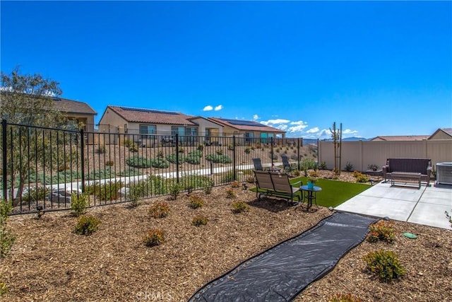 view of yard featuring central AC unit and a patio area