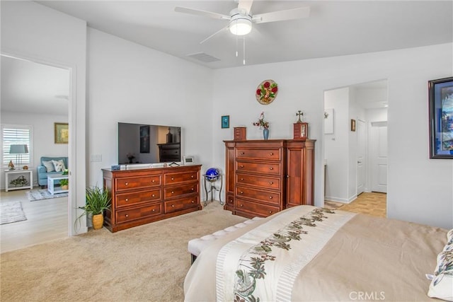 bedroom with light colored carpet and ceiling fan