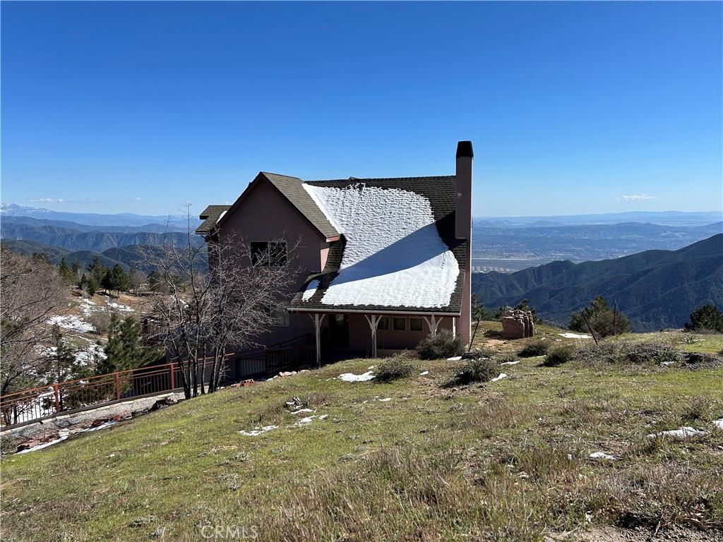 view of side of property featuring a mountain view