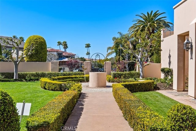 surrounding community with a fenced front yard and a lawn