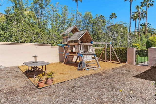 view of jungle gym with fence