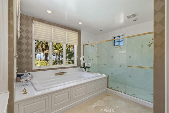 full bath with a stall shower, plenty of natural light, visible vents, and a bath