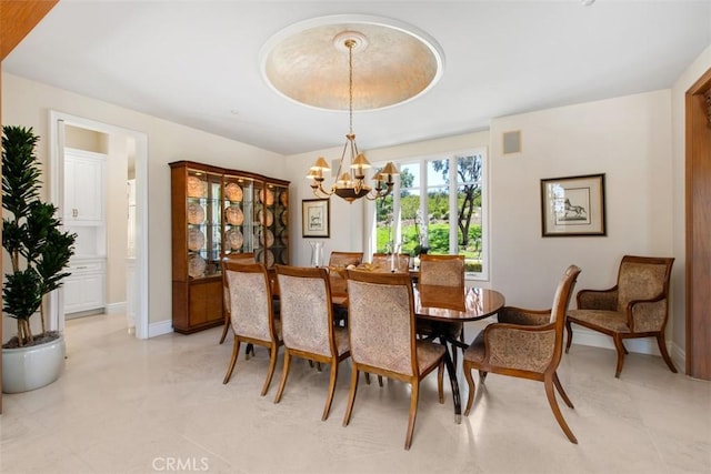 dining area featuring baseboards, visible vents, and a notable chandelier