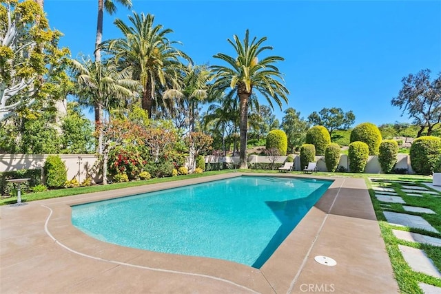 view of swimming pool with fence and a fenced in pool