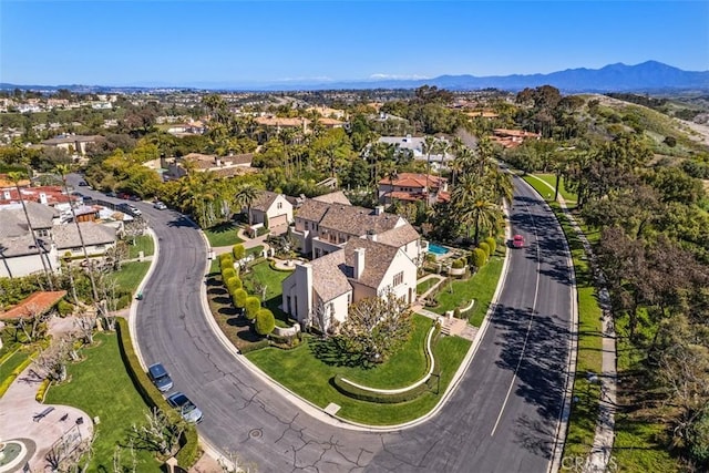 drone / aerial view featuring a residential view and a mountain view