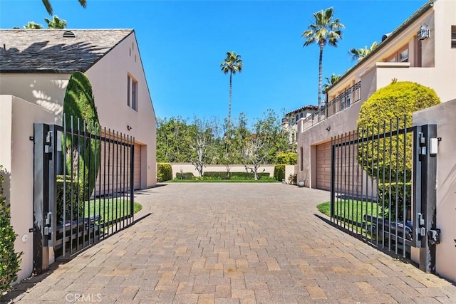 view of gate with fence